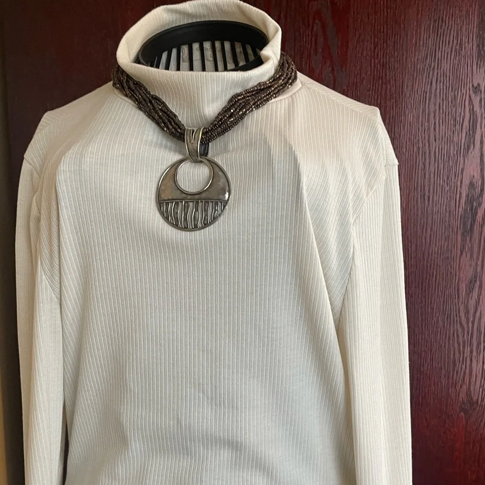 Make a statement with this twisted beaded necklace that has this unique pendant. - Picture 4 of 4